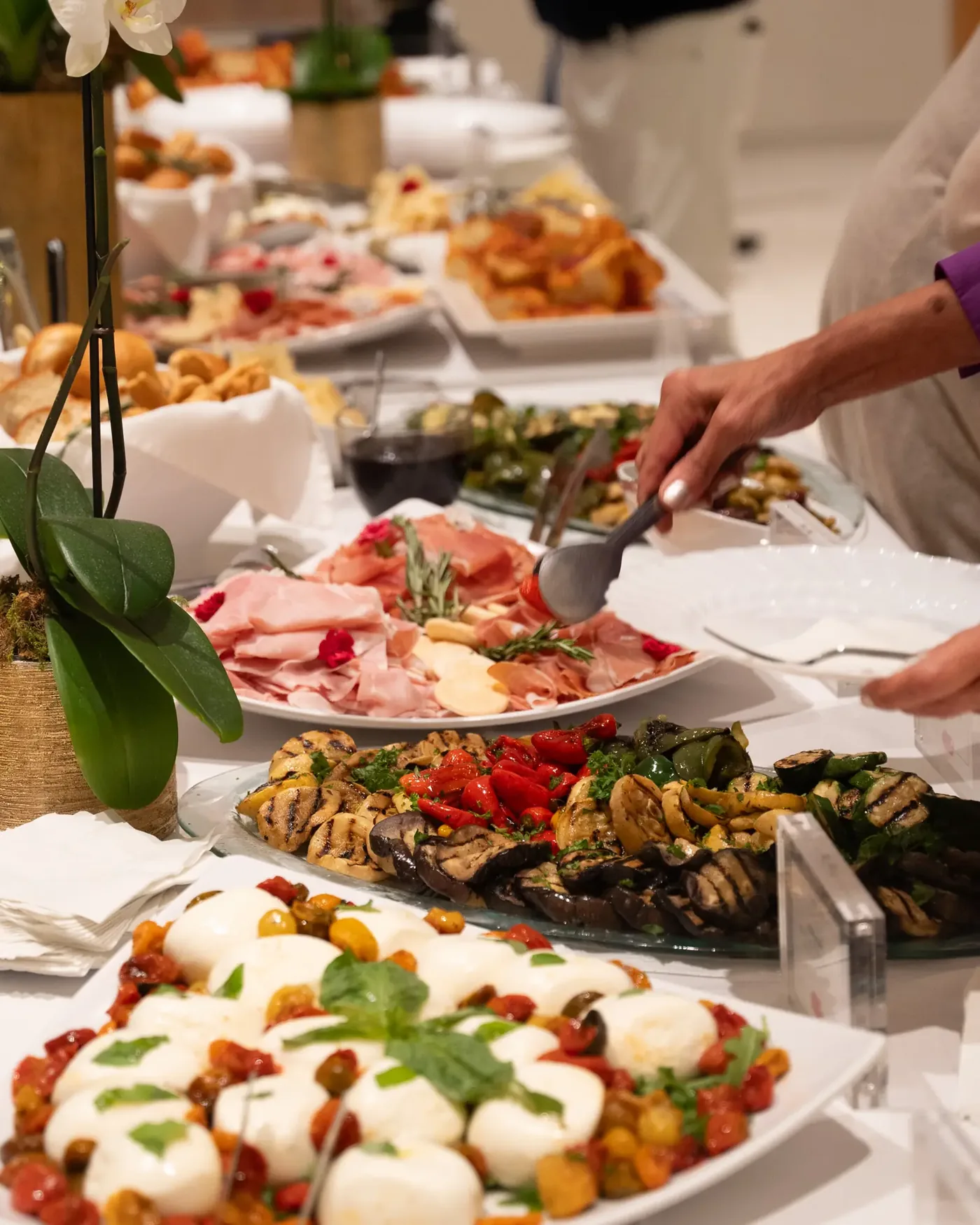 Grazing table with cheeses, charcuterie and fruit by The Caterer LV